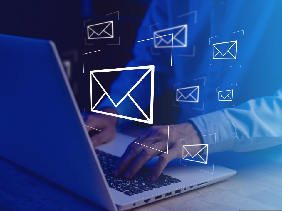 businessman,hands,typing,notebook,(laptop),with,email,icon,and,send